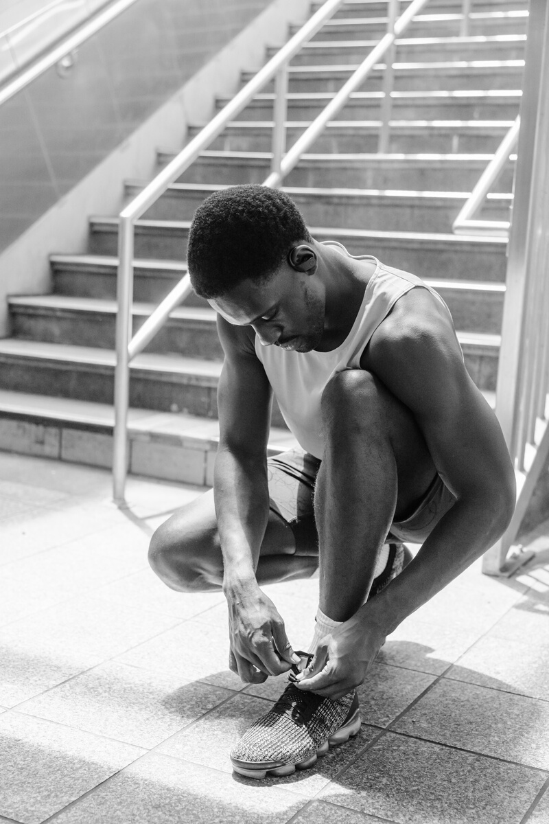 Man Tying His Shoe Lace